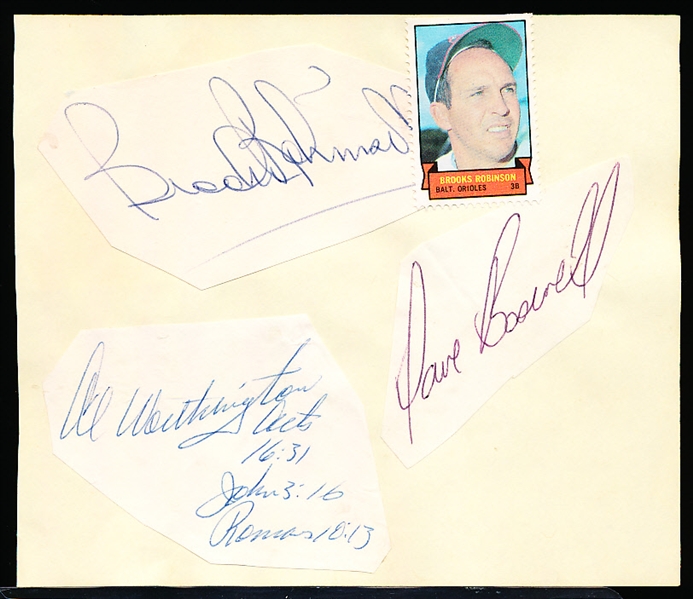 Autographed Brooks Robinson, Dave Boswell, & Al Worthington Cut Bsbl. Signatures Glued to an Album Page