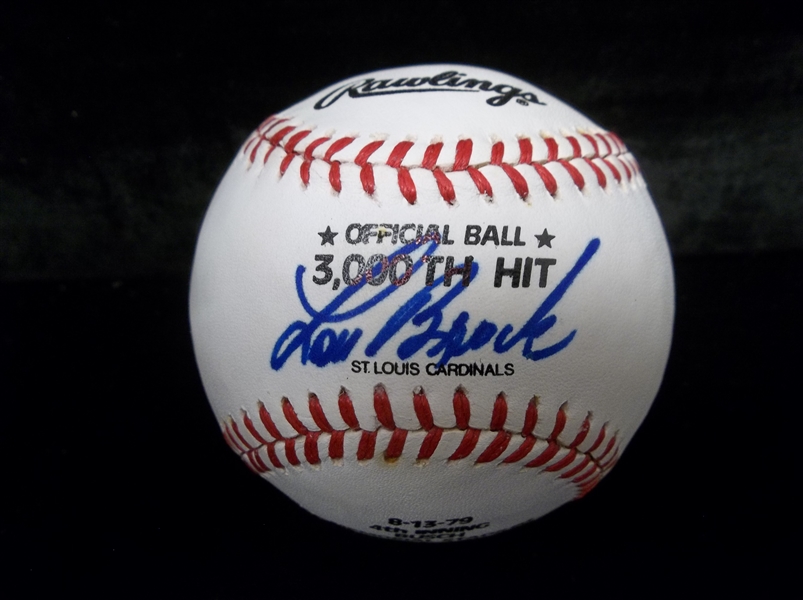 Autographed Lou Brock Rawlings MM1 Playmaker 3,000 Hit Bsbl.- Signed by Brock