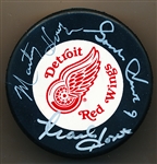 Autographed Howe Family Red Wings Trench Logo Puck- JSA Certified
