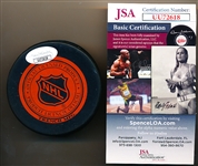 Autographed Howe Family Red Wings Trench Logo Puck- JSA Certified