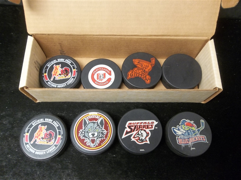 Hockey Logo Puck Lot- 7 Pucks